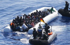 42 people drown after boat carrying 450 migrants capsizes at sea