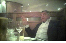 The internet can't decide if England's football manager is drinking a pint of wine in this photo