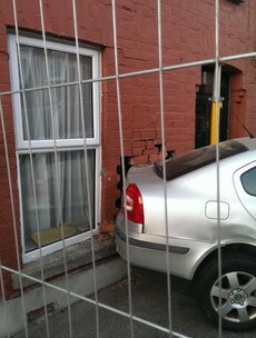 'Substantial damage' caused as car crashes into front wall of house