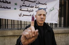 Syrian troops and army defectors clash as elections underway