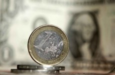 Euro falls to 11-month low against dollar