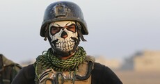 Iraqi forces battle through sniper fire and suicide bombs to retake IS-held city