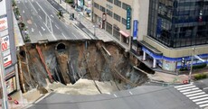 Japanese city street swallowed by giant sinkhole