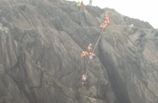 Man rescued from cliff ledge after falling into the sea