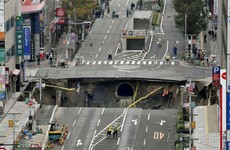 Japanese workers praised as street swallowed by sinkhole reopens after just a week