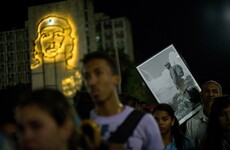 Crowds chant 'I am Fidel' as leader's ashes reunited with Che Guevara