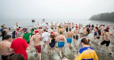 Pics: A lot of brave souls braved the elements for a Christmas swim (or run) today