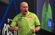 Phenomenal Van Gerwen smashes record average to book World Championship final spot