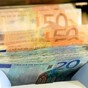 Armed man steals money from safe and wallets at travel agent
