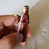 A great grandmother has accidentally been praying to a Lord of the Rings figurine
