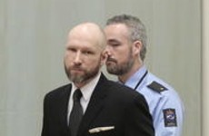 Norwegian mass murderer makes Nazi salute as court reviews 'inhumane' prison regime