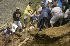 Landslide kills 25 and buries dozens more in Philippines