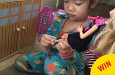 This little girl makes her dolls take their shoes off before entering her Barbie Dreamhouse