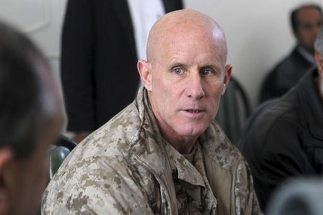 In this image provided by the U.S. Marine Corps, Vice Adm. Robert S. Harward, commanding officer of Combined Joint Interagency Task Force 435, speaks to an Afghan official.