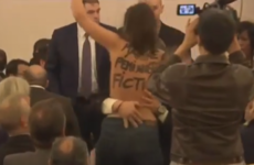 Topless protester disrupts Marine Le Pen speech