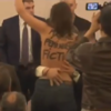 Topless protester disrupts Marine Le Pen speech