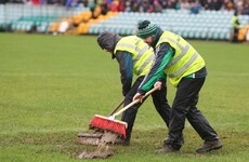 Is there anything more Irish than sweeping the rain off the pitch for a match?