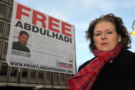 Mary Lawlor of Frontline Defenders in front of the banner bearing Abdulhadi's image on Earlsfort Terrace/St Stephen's Green