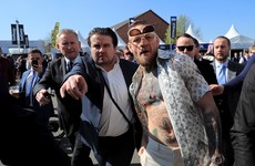 Conor McGregor just rolled up to the Grand National in an unbuttoned shirt wearing these shades