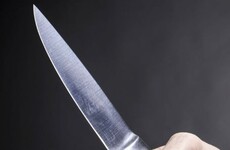 Woman in her 60s threatened by female with knife when she answered door