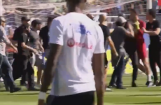 Ligue 1 game abandoned after pitch invaders try to attack Lyon players