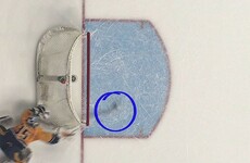 Ice hockey keeper makes incredible diving save from outside the net after puck takes a mad bounce