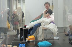 French 'human hen' artist hatches first chick after three weeks of sitting on 10 eggs