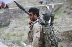 Gunmen 'disguised as soldiers' gain access to Afghan military base and kill over 100 people