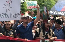 Everyone is loving Leo DiCaprio's tiny handwritten sign at a climate change protest