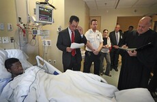 Suspected killer of engaged Boston doctors is charged while lying in his hospital bed
