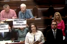 Solidarity-PBP TDs refuse to stand for Dáil prayer and hold up 'separate Church and State' posters