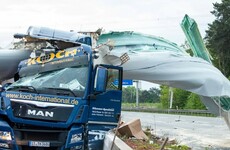 Driver has lucky escape after huge wind turbine blade hits lorry