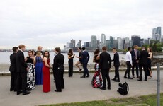 Justin Trudeau was out jogging and ended up brilliantly photobombing a group prom picture