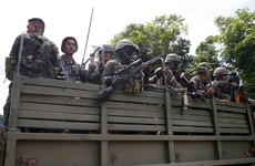 IS-linked militants have taken parts of a Philippine city and have been killing women and children