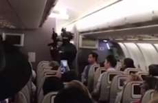 Man who threatened to 'blow up' plane is wrestled to the floor by passengers