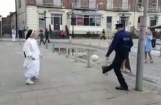 A garda and a nun playing a game of keepie-uppies is the most Limerick thing to ever happen