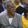 Jay Z has been caught rapid awkwardly fake laughing for photos