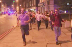 A photo of a man being evacuated in London last night and refusing to leave his pint behind has taken over Twitter