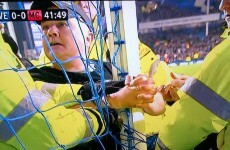 Fan handcuffs himself to the post during Everton's game with Man City