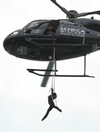 Daredevil woman hangs from helicopter above Niagara Falls... by her teeth