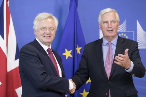 The UK's chief negotiator David Davis shakes hands with his EU counterpart Michel Barnier today.