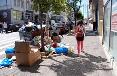 Rubbish is piling up on Athens' streets as temperatures soar