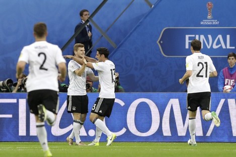Germany's Lars Stindl, center right, celebrates after scoring.