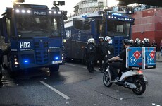 This Dominos delivery man was determined not to be stopped from doing his job by G20 riots in Germany