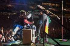 Coldplay brought a crowd-surfing Irish fan in a wheelchair on stage to perform with them in Croke Park