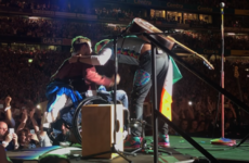 Coldplay brought a crowd-surfing Irish fan in a wheelchair on stage to perform with them in Croke Park