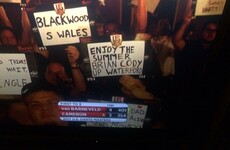 A Waterford fan held up a great sign ripping Kilkenny on TV at a darts event in Las Vegas