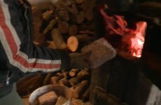 WATCH: Hungarians burn banknotes to keep warm