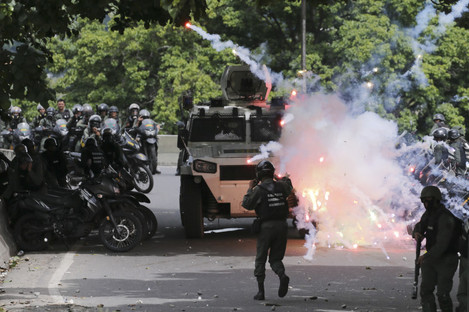 Protesters clash with security forces in the Venezuelan capital, Caracas