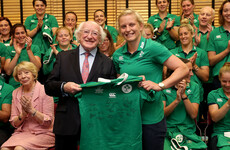 Snap happy! President Michael D Higgins presents the Ireland side with their jerseys